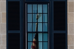 Victor-Mistretta-Colonial-Window-With-Flag-Reflection-Oct-2024-Digital-Color-Theme_-Architectural-Detail-Salon-Medal